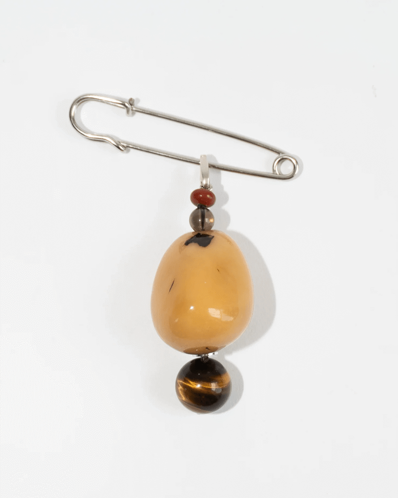 Curated selection of 10 design and fashion pieces – The Curalist weekly edit. Here a brooch with antiques breloque