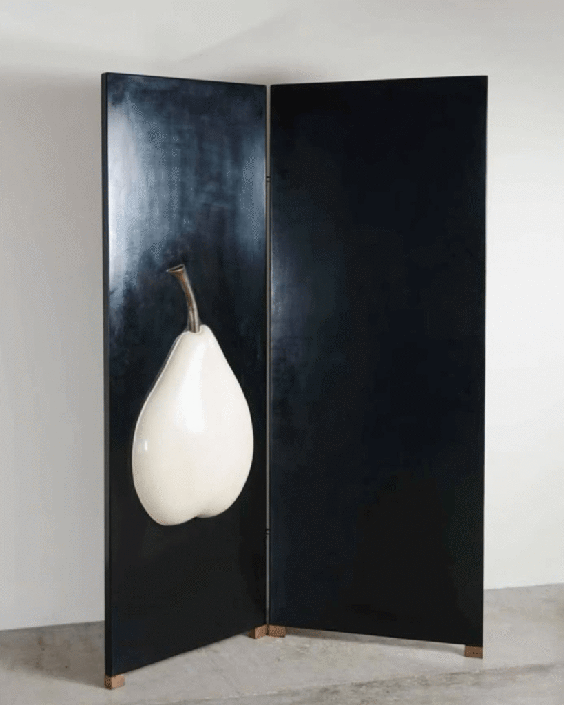 A List of 10 curated objects and pieces essential pieces blending culture, design, and fashion, selected for discerning and curious readers. Here a panel Screen by Robert Kuo with a graphic pear on it