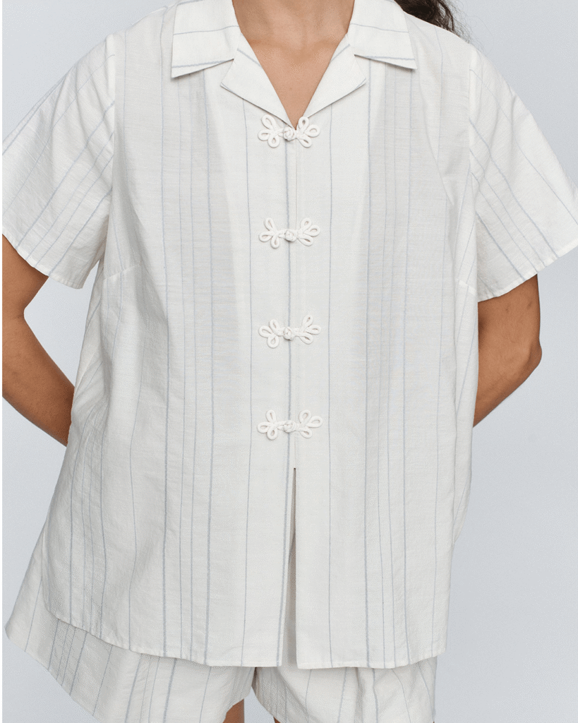 a person wearing a white shirt from the brand marle.