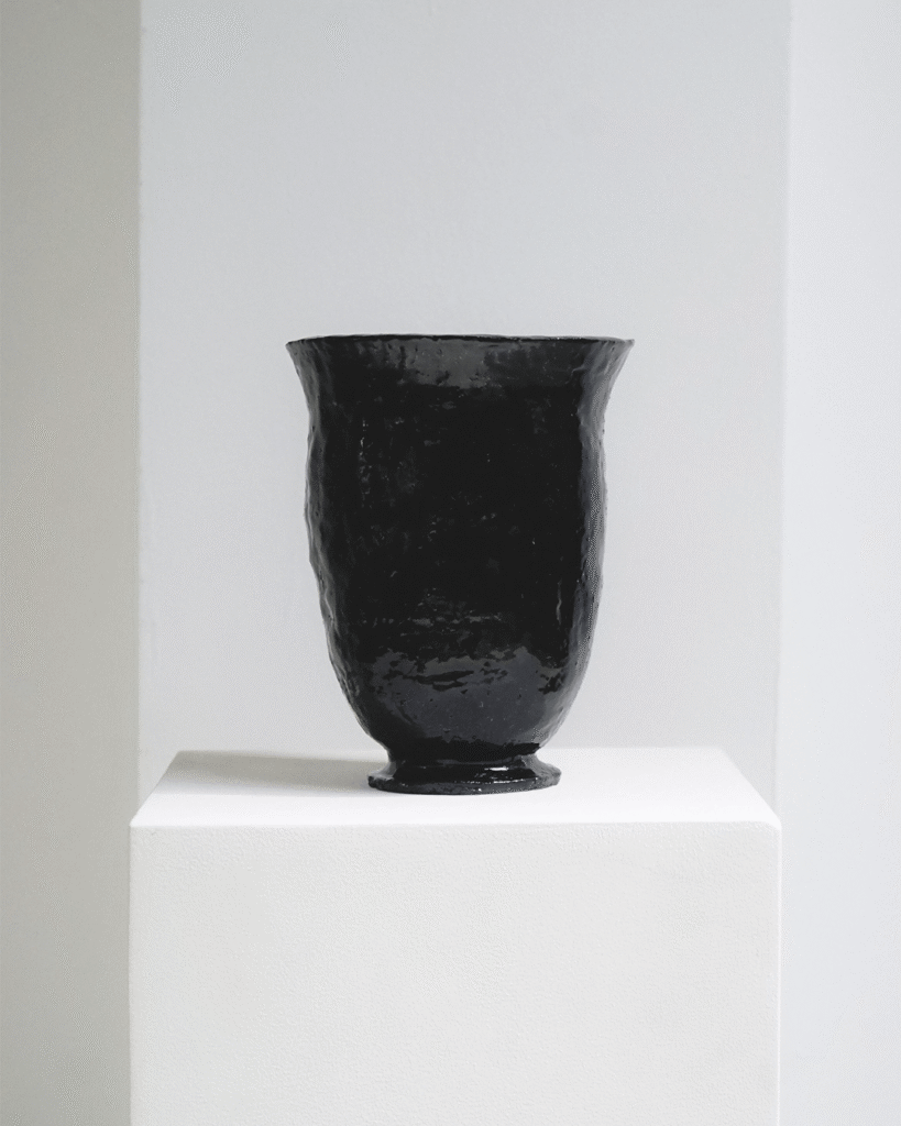 Black Chalice Ceramic Vase - this handbuilt vase is made from dark stoneware with a heavily textured surface finshed with a black shiny glaze. the chalice form gives it character and makes it feel both ancient and modern.